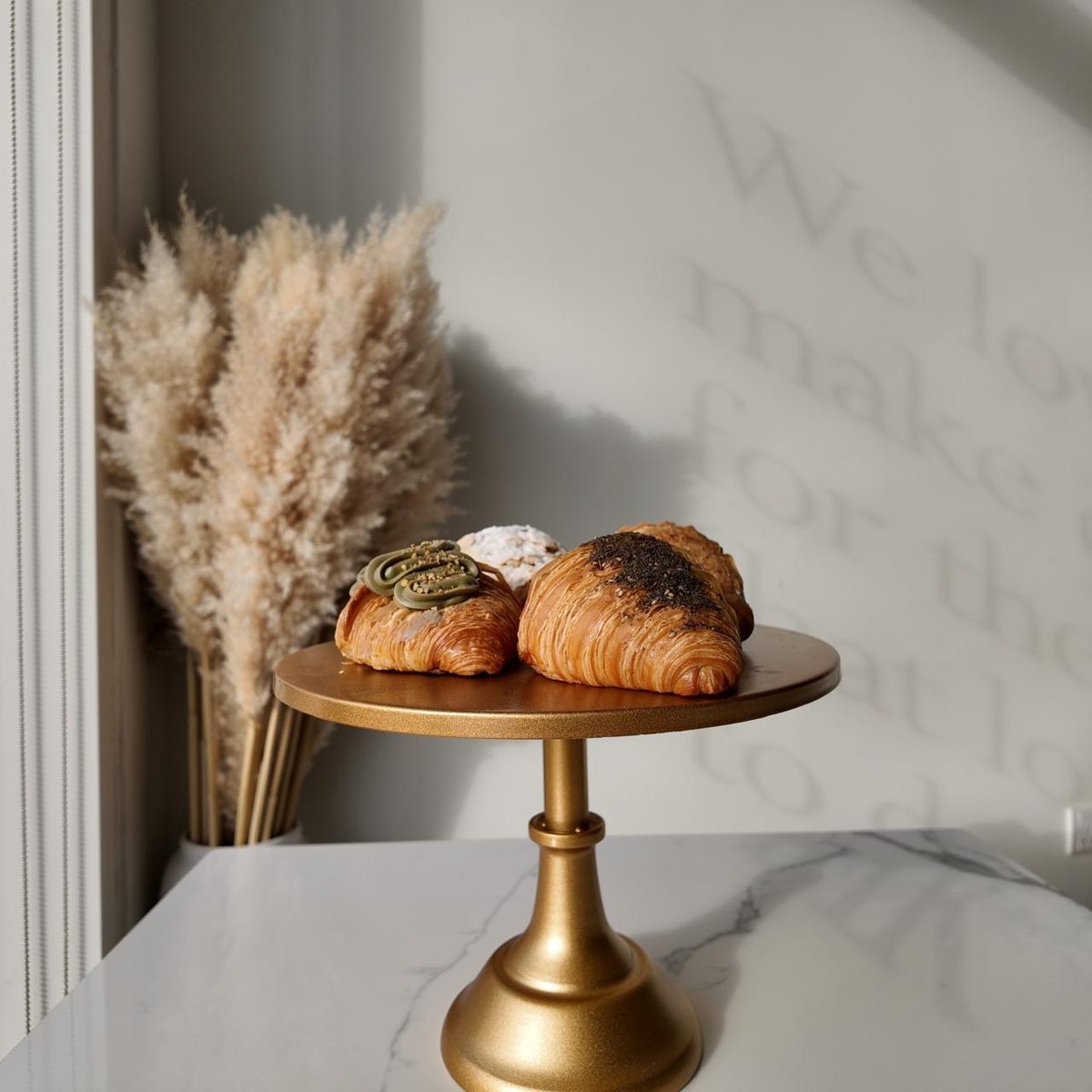 Croissants on a gold stand at Stay